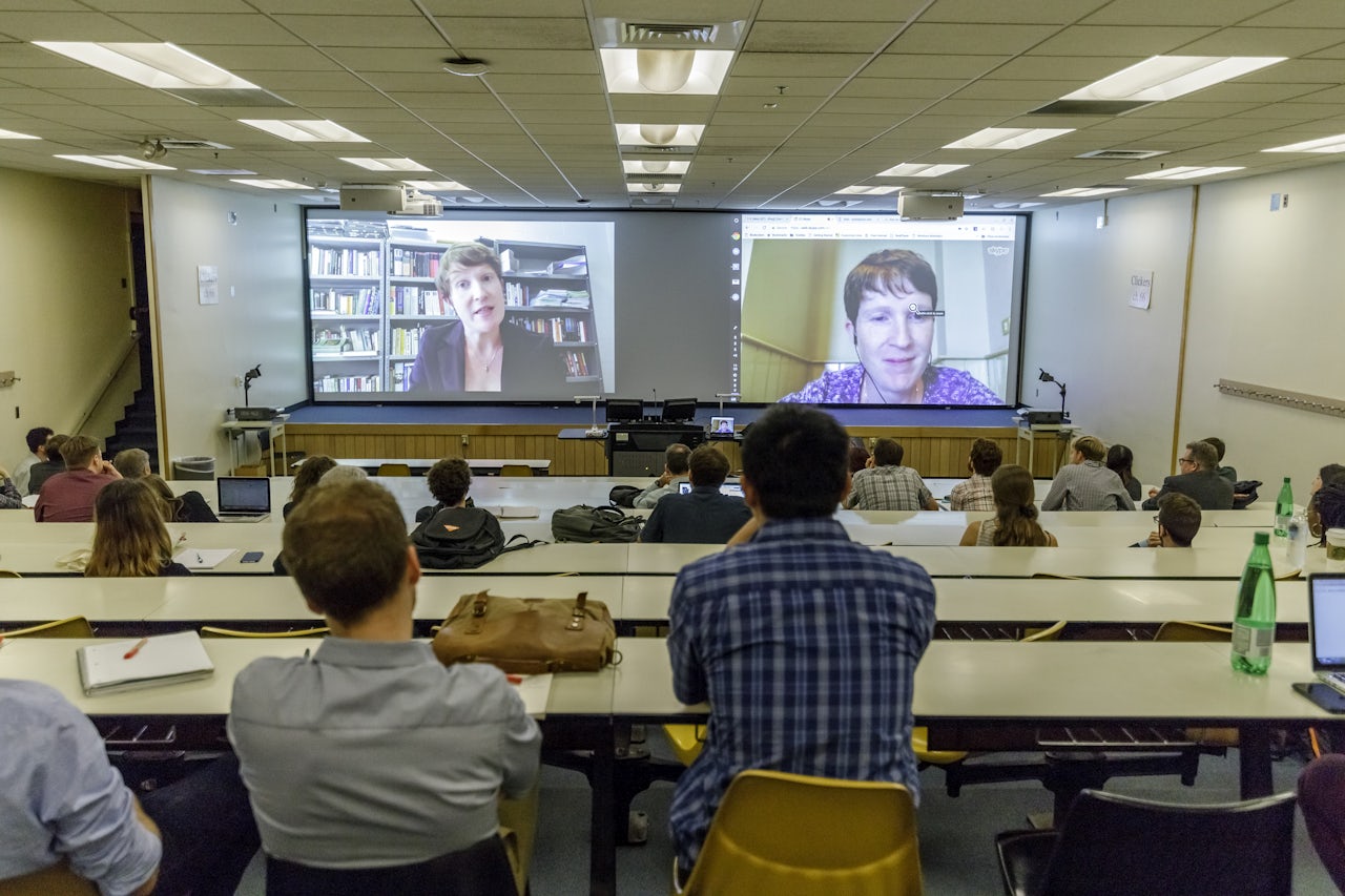 Attendees watching Clare Hayes-Brady’s keynote (left) and Hayes-Brady live via Skype (right)