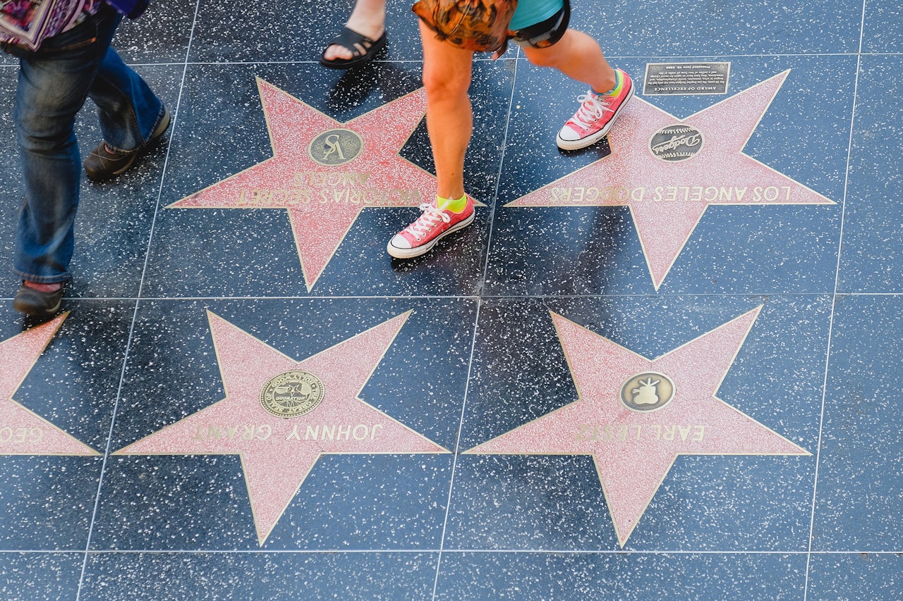 Tourists on the Walk of Fame in June.