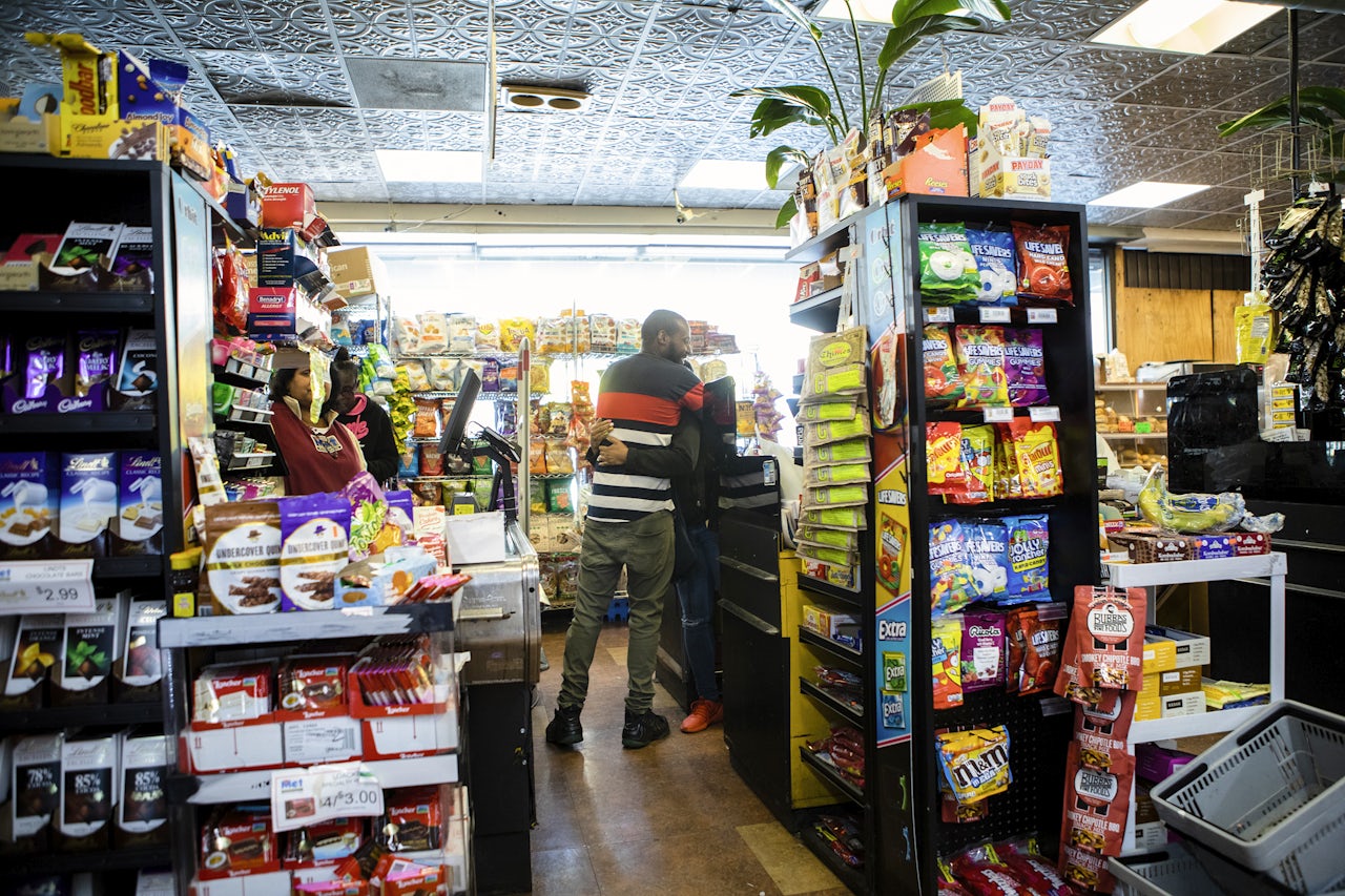 A cashier and a surprise visitor.