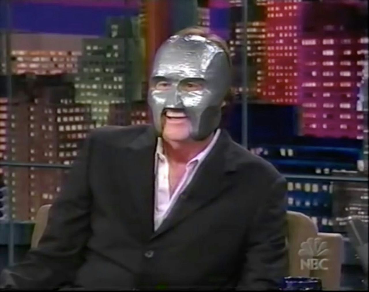 Jim Carrey wears a replica 'Mr. Personality' mask to begin his 2003 appearance on 'The Tonight Show.'