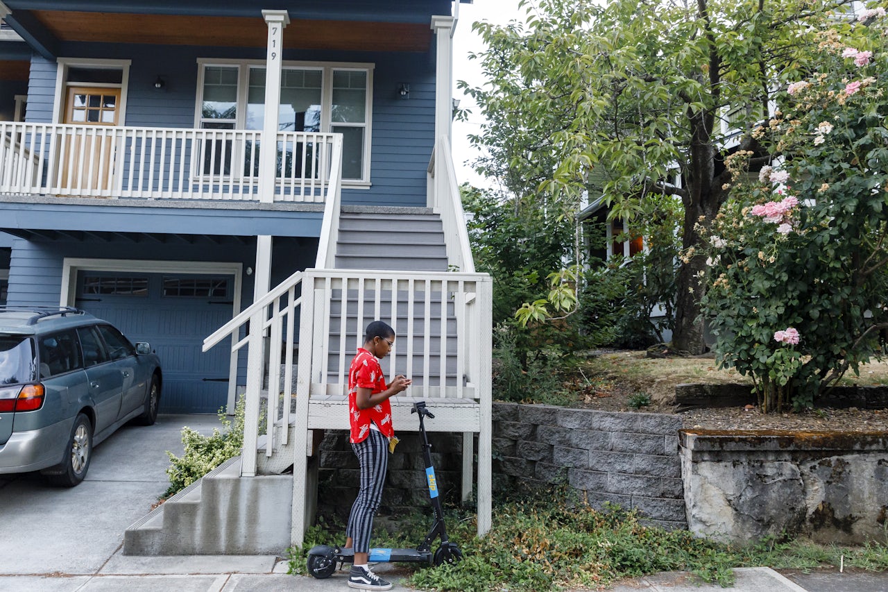 After two foiled attempts, the author locates a scooter outside of someone's home.