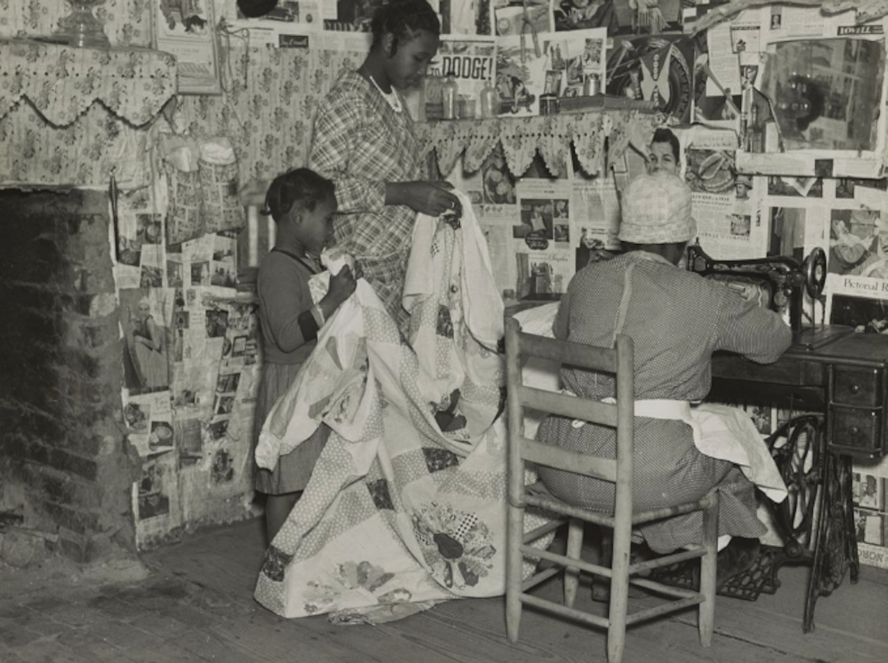 Lucy Mooney making a quilt with her granddaughters in 1937. She once worked as the cook on the Pettway plantation.
