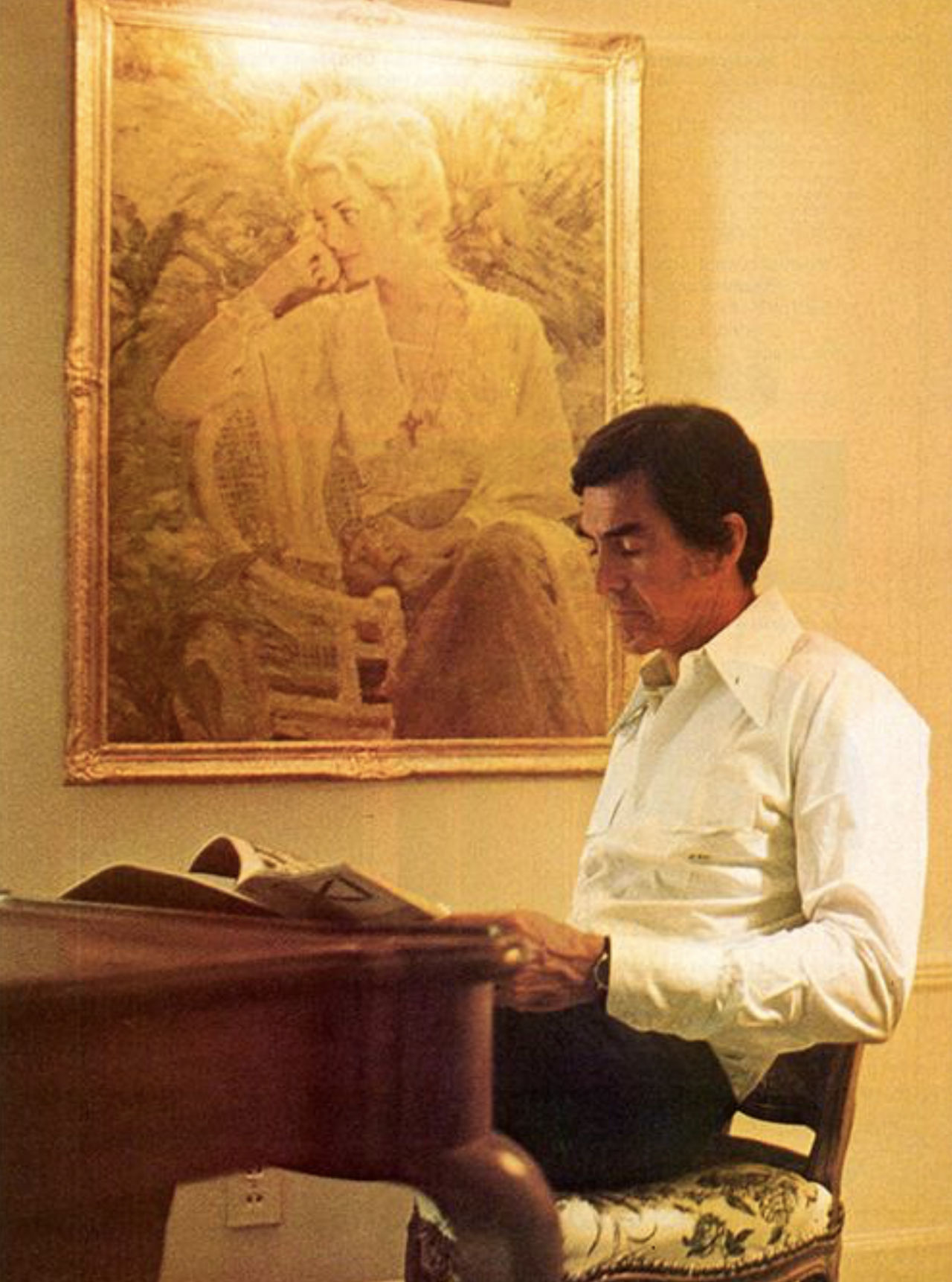 DeLorean with a portrait of Kelly Harmon, in a photo taken shortly after she left him.