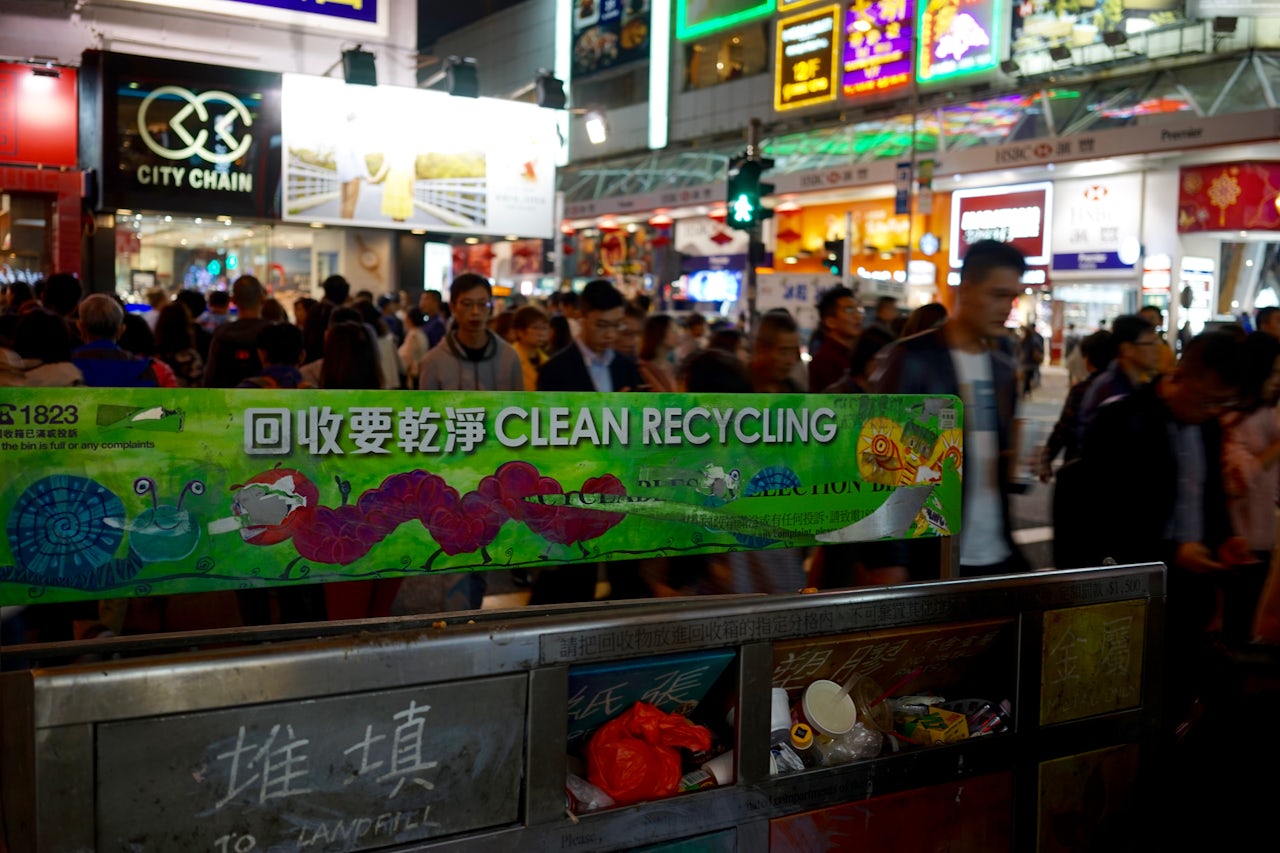 Old signage that used to read “Litter cum recyclables collection bin” painted over with art.