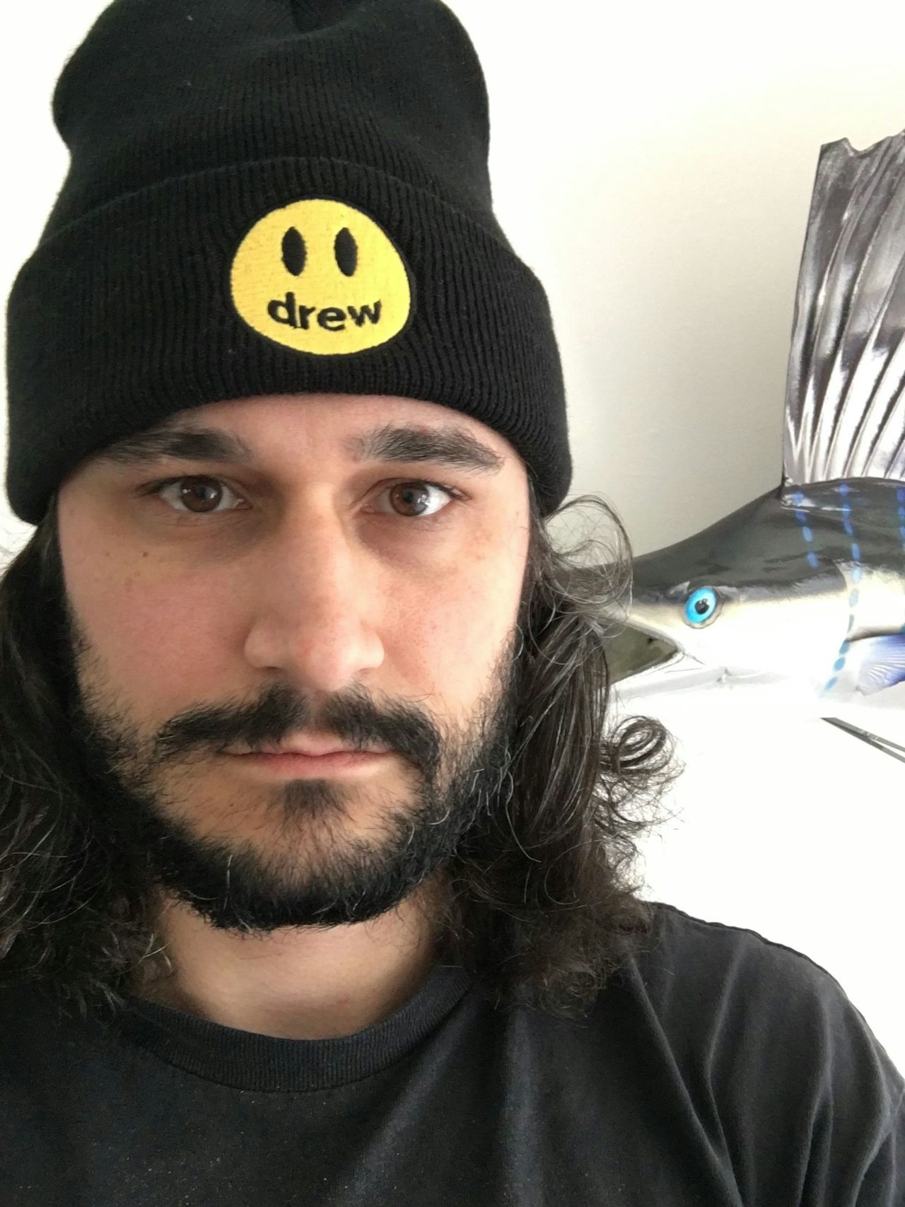 Selfie of the author, Drew, wearing House of Drew, inside the house of Drew, the author.