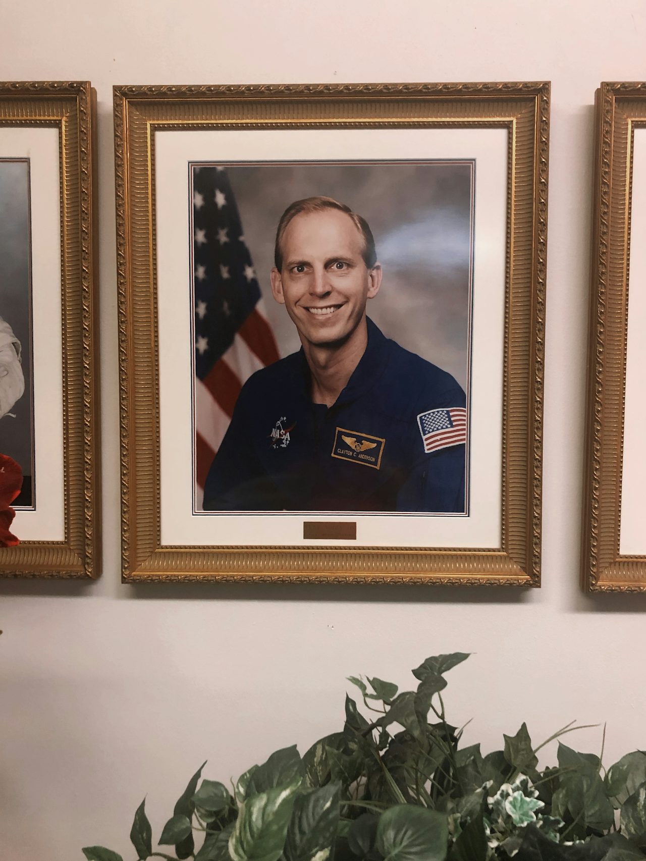 A photo of retired astronaut Clayton Anderson hanging in the church’s library.
