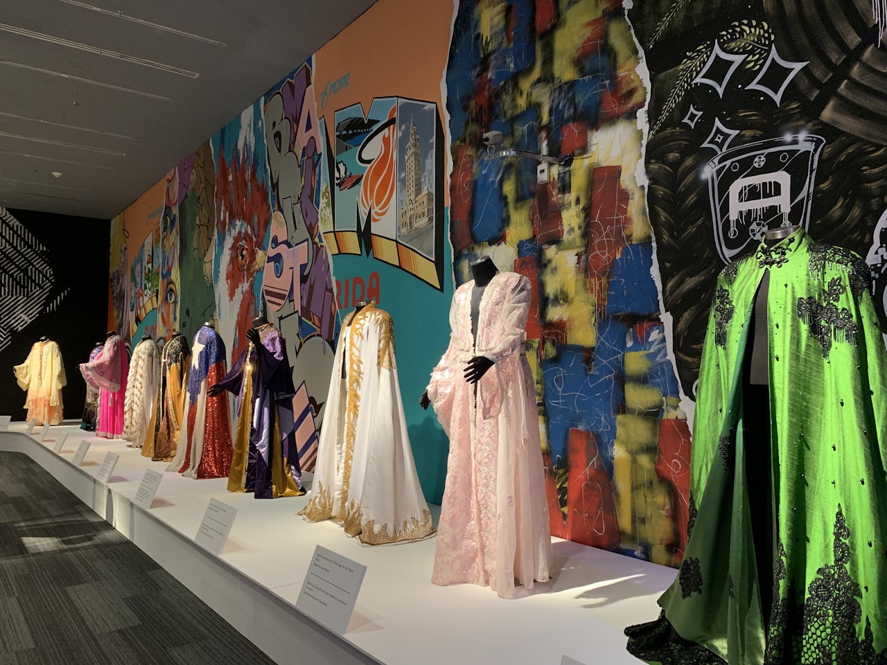 Multiple of Walter Mercado's capes on display.