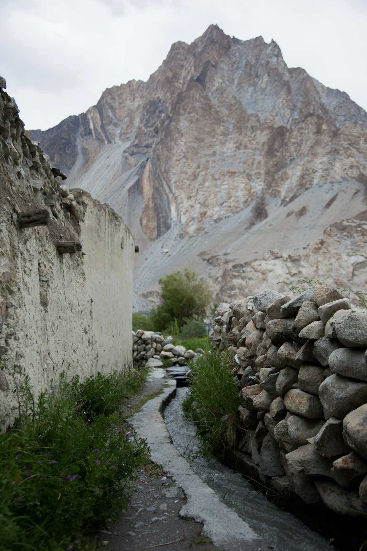An irrigation channel in Passu, a remote village that only exists because of water flow from glaciers. Farming fields go without water when irrigation lines are broken by glacier movement.