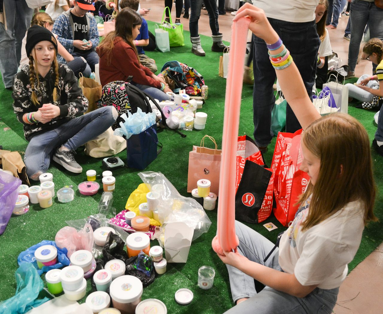 Slimers play with their merchandise.