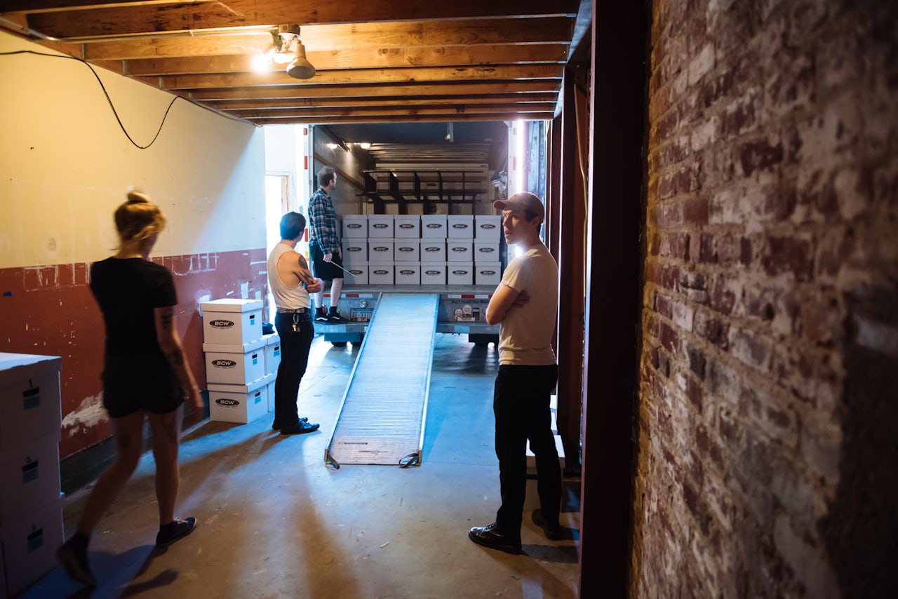 Left to right: Shitworkers Julia Booz, Matt Badenhop, Paul Curran, and Joe Frankl strategize on how to safely transport the archive.