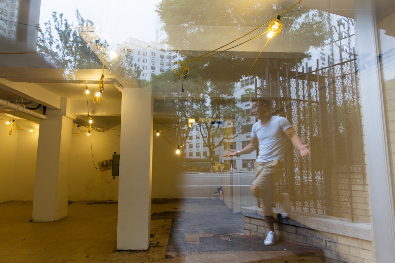 Jang in front of his old storefront, Royal Cleaners